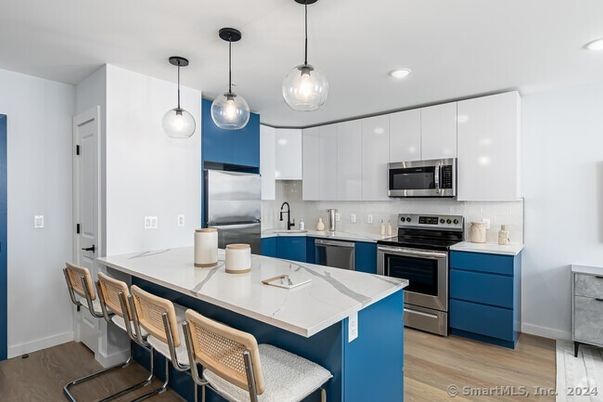 Interior, Kitchen, Pendant Lights, Recessed Lighting, Stainless Steel Appliances, Wood Texture Flooring