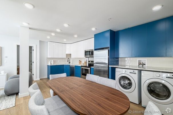 Dining room, Interior, Kitchen, Recessed Lighting, Stainless Steel Appliances, Washer, Wood Texture Flooring