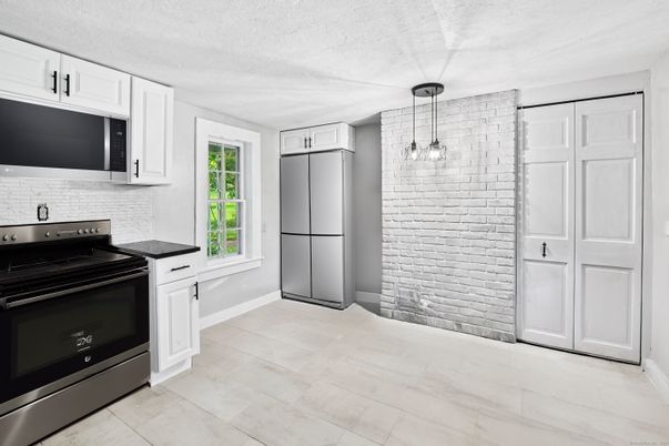 Interior, Kitchen, Pendant Lights, Stainless Steel Appliances, Stone Walls