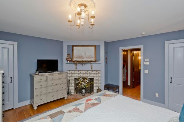 Bedroom, Chandelier, Fireplace, Interior, Wood Texture Flooring