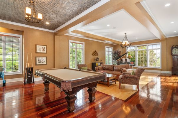 Billiard Table, Chandelier, Game Room, Interior, Living room, Pendant Lights, Recessed Lighting, Wood Texture Flooring