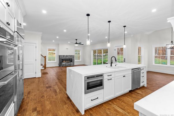 Fireplace, Interior, Kitchen, Pendant Lights, Recessed Lighting, Stainless Steel Appliances, Wood Texture Flooring