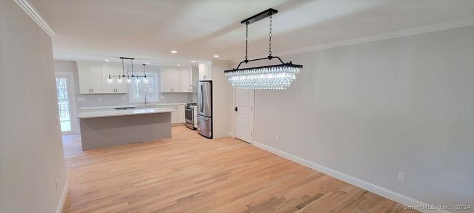 Chandelier, Interior, Kitchen, Pendant Lights, Recessed Lighting, Stainless Steel Appliances, Wood Texture Flooring