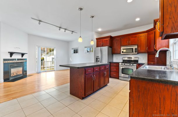Fireplace, Interior, Kitchen, Pendant Lights, Recessed Lighting, Stainless Steel Appliances, Wood Texture Flooring