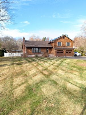Attached, Backyard, Exterior, Facade, Brick Facade, Log Home
