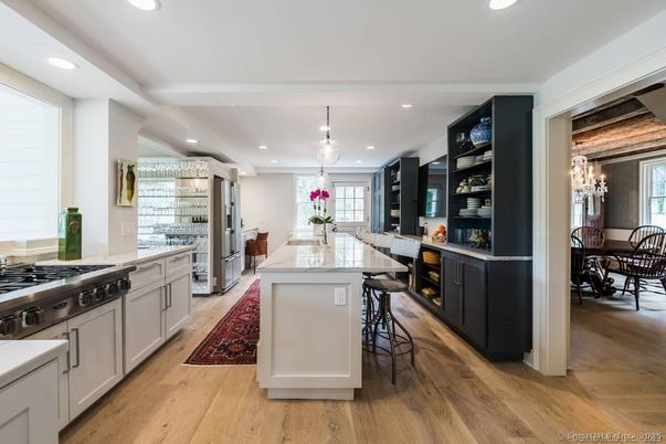 Chandelier, Dining room, Interior, Kitchen, Pendant Lights, Recessed Lighting, Stainless Steel Appliances, Wood Texture Flooring