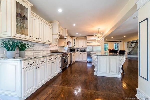 Chandelier, Interior, Kitchen, Pendant Lights, Recessed Lighting, Stainless Steel Appliances, Wood Texture Flooring