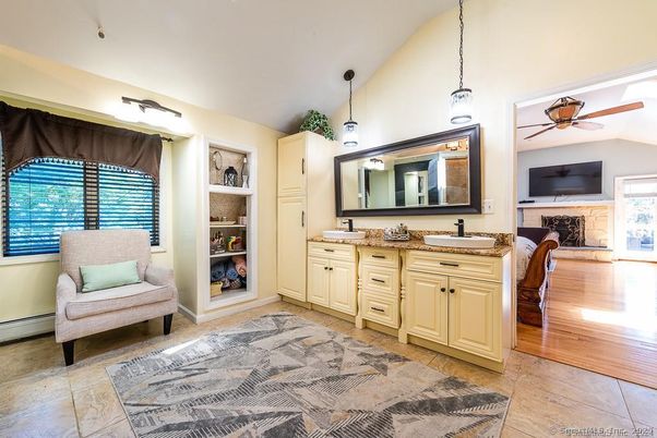 Bathroom, Dual Sink Vanities, Fireplace, Interior, Pendant Lights, Wood Texture Flooring