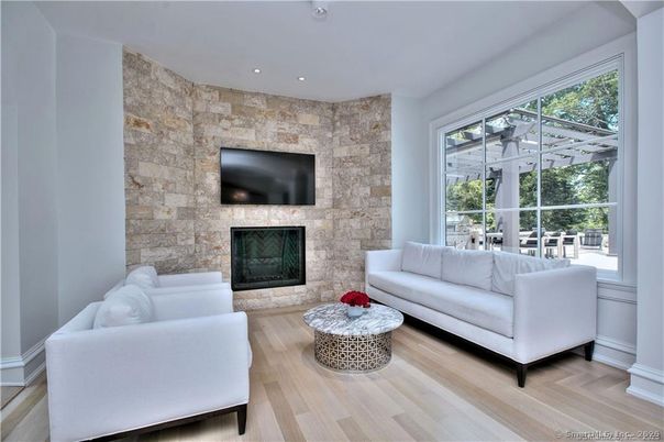 Fireplace, Interior, Living room, Recessed Lighting, Stone Walls, Wood Texture Flooring