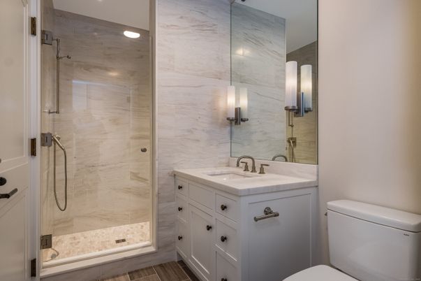 Bathroom, Glass Shower, Interior, Marble Walls, Recessed Lighting, Wood Texture Flooring