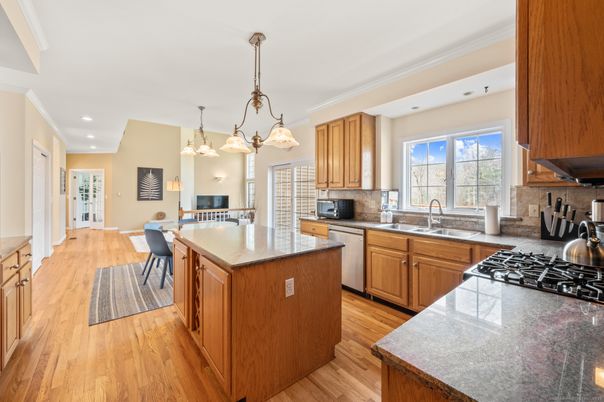 Chandelier, Dining room, Interior, Kitchen, Pendant Lights, Recessed Lighting, Stainless Steel Appliances, Wood Texture Flooring