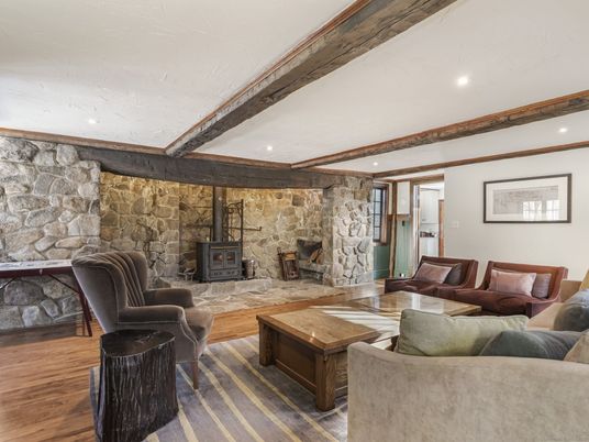Fireplace, Interior, Living room, Recessed Lighting, Stone Walls, Wood Texture Flooring