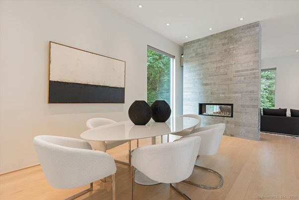 Dining room, Fireplace, Interior, Recessed Lighting, Stone Walls, Wood Texture Flooring
