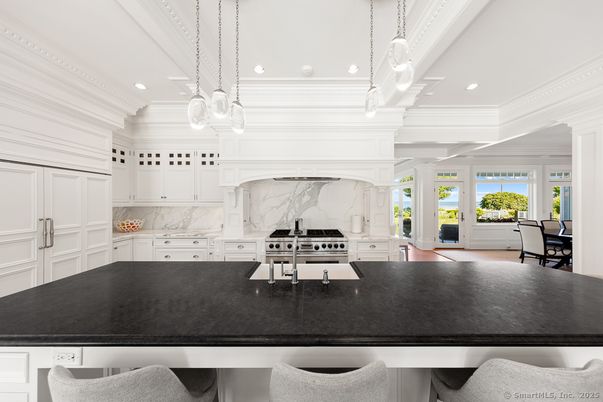 Interior, Kitchen, Marble Walls, Pendant Lights, Recessed Lighting, Stainless Steel Appliances, Wood Texture Flooring