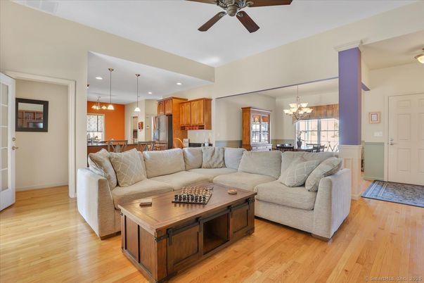 Chandelier, Dining room, Interior, Kitchen, Living room, Pendant Lights, Recessed Lighting, Stainless Steel Appliances, Wood Texture Flooring