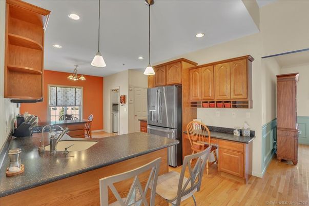 Dining room, Interior, Kitchen, Pendant Lights, Recessed Lighting, Stainless Steel Appliances, Wood Texture Flooring