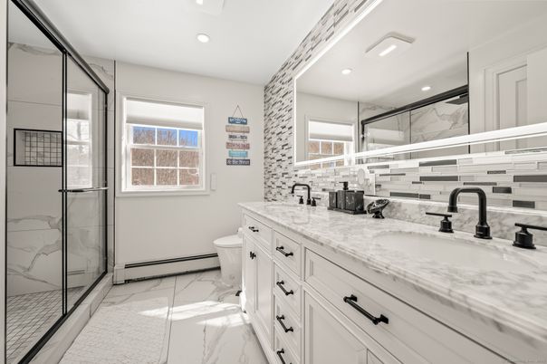 Bathroom, Dual Sink Vanities, Glass Shower, Interior, Marble, Marble Walls, Recessed Lighting