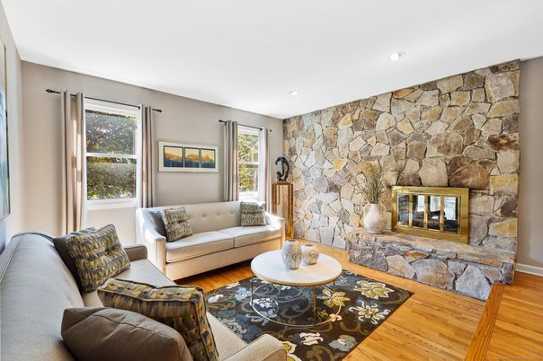 Fireplace, Interior, Living room, Recessed Lighting, Stone Walls, Wood Texture Flooring