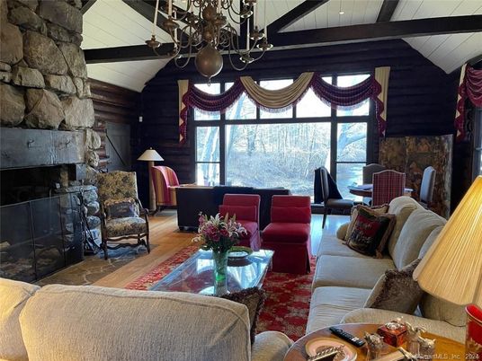 Chandelier, Fireplace, Interior, Living room, Stone Walls, Wooden Beams, Wood Texture Flooring