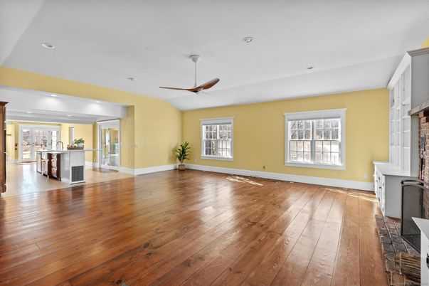 Empty room, Fireplace, Interior, Kitchen, Recessed Lighting, Wood Texture Flooring