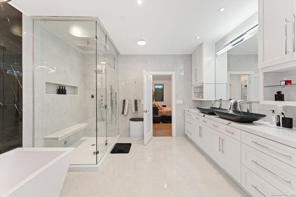 Bathroom, Dual Sink Vanities, Free Standing Baths, Glass Shower, Interior, Recessed Lighting, Wood Texture Flooring