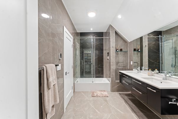 Bathroom, Dual Sink Vanities, Glass Shower, Interior, Marble Walls, Recessed Lighting