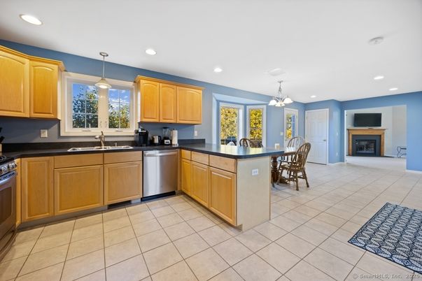 Dining room, Fireplace, Interior, Kitchen, Pendant Lights, Recessed Lighting, Stainless Steel Appliances