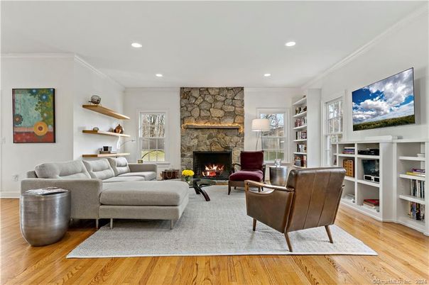Fireplace, Interior, Living room, Recessed Lighting, Stone Walls, Wood Texture Flooring