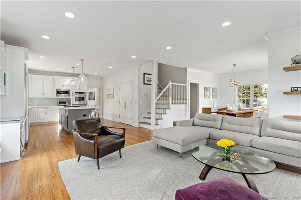 Chandelier, Dining room, Interior, Kitchen, Living room, Pendant Lights, Recessed Lighting, Stainless Steel Appliances, Wood Texture Flooring