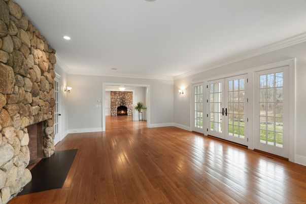Empty room, Fireplace, Interior, Recessed Lighting, Stone Walls, Wood Texture Flooring