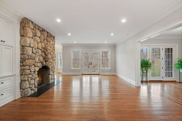 Empty room, Fireplace, Interior, Recessed Lighting, Stone Walls, Wood Texture Flooring