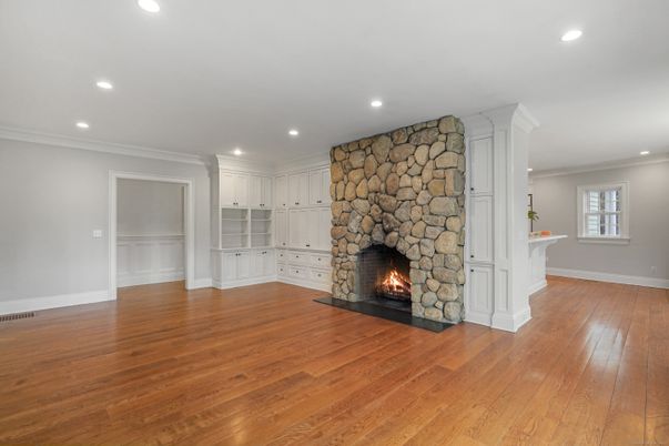 Empty room, Fireplace, Interior, Recessed Lighting, Stone Walls, Wood Texture Flooring