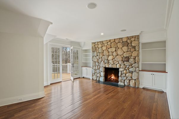 Empty room, Fireplace, Interior, Recessed Lighting, Stone Walls, Wood Texture Flooring
