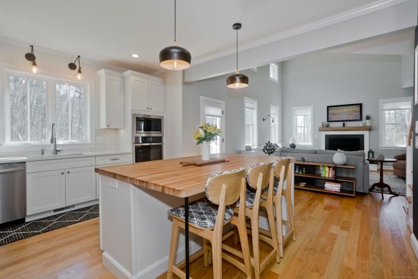 Fireplace, Interior, Kitchen, Pendant Lights, Recessed Lighting, Stainless Steel Appliances, Wood Texture Flooring