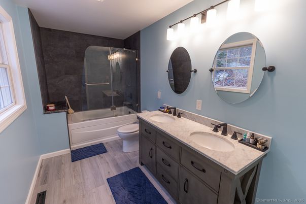 Bathroom, Dual Sink Vanities, Glass Shower, Interior, Wood Texture Flooring
