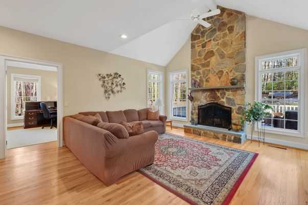 Fireplace, Interior, Living room, Recessed Lighting, Stone Walls, Wood Texture Flooring