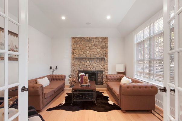 Fireplace, Interior, Living room, Recessed Lighting, Stone Walls, Wood Texture Flooring