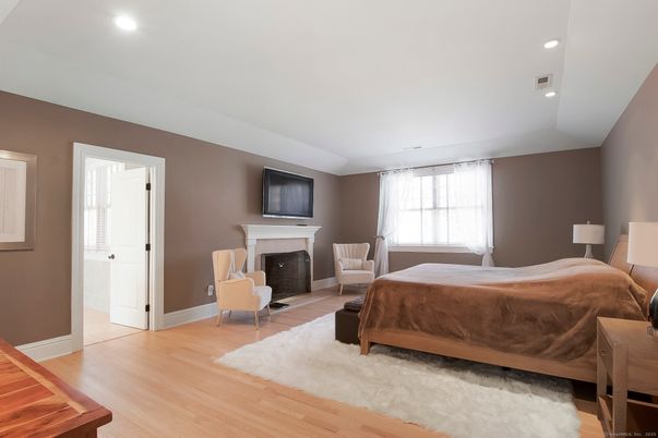 Bedroom, Fireplace, Interior, Recessed Lighting, Wood Texture Flooring