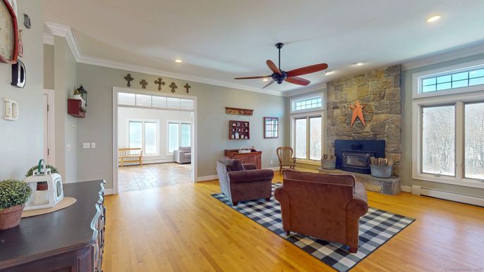 Fireplace, Interior, Living room, Recessed Lighting, Stone Walls, Wood Texture Flooring