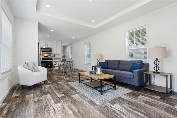 Dining room, Interior, Kitchen, Living room, Recessed Lighting, Stainless Steel Appliances, Wood Texture Flooring