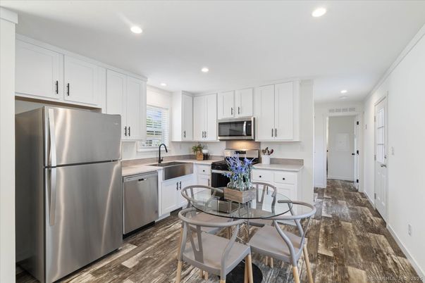 Dining room, Interior, Kitchen, Recessed Lighting, Stainless Steel Appliances, Wood Texture Flooring