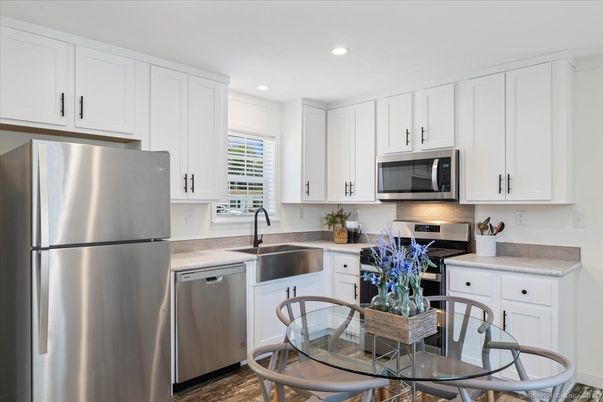 Dining room, Interior, Kitchen, Recessed Lighting, Stainless Steel Appliances, Wood Texture Flooring