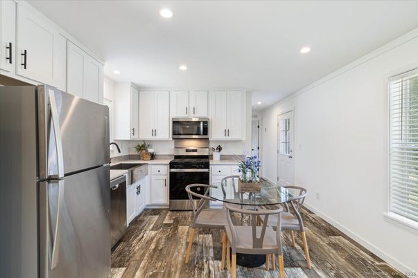 Dining room, Interior, Kitchen, Recessed Lighting, Stainless Steel Appliances, Wood Texture Flooring