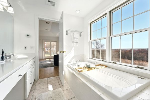 Bathroom, Dual Sink Vanities, Interior, Recessed Lighting, Tile Countertops, Wood Texture Flooring