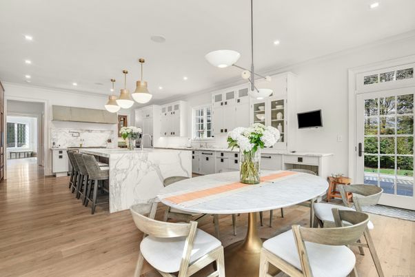 Dining room, Interior, Kitchen, Marble Walls, Pendant Lights, Recessed Lighting, Stainless Steel Appliances, Wood Texture Flooring