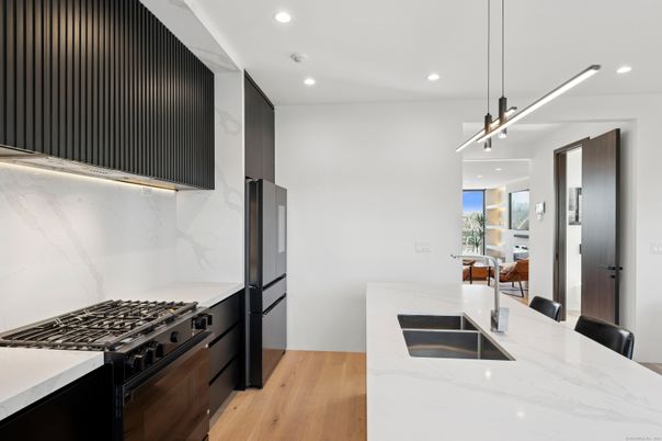 Interior, Kitchen, Marble Walls, Pendant Lights, Recessed Lighting, Wood Texture Flooring