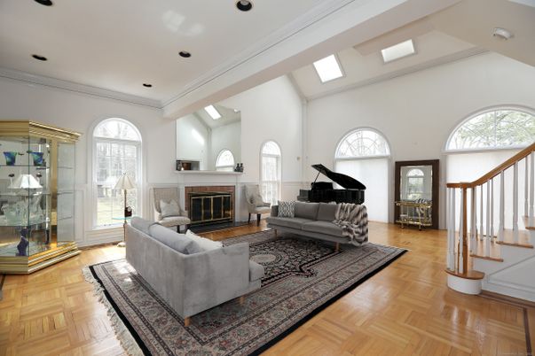 Fireplace, Interior, Living room, Piano, Recessed Lighting, Wood Texture Flooring
