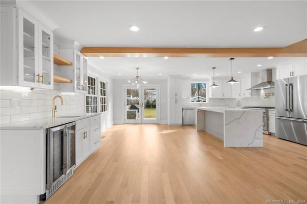 Interior, Kitchen, Marble Walls, Pendant Lights, Recessed Lighting, Stainless Steel Appliances, Wood Texture Flooring