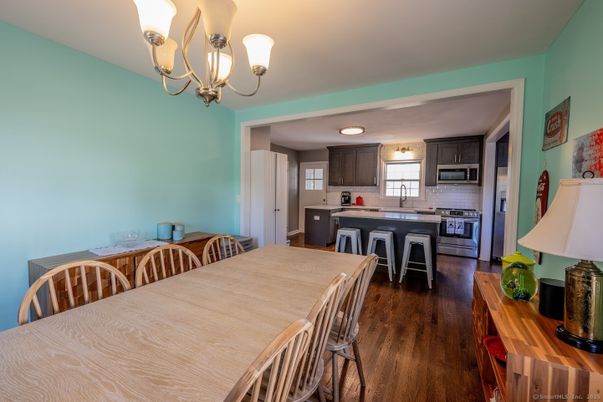 Chandelier, Dining room, Interior, Kitchen, Stainless Steel Appliances, Wood Texture Flooring