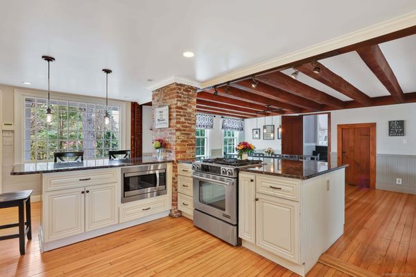 Interior, Kitchen, Pendant Lights, Recessed Lighting, Stainless Steel Appliances, Stone Walls, Wooden Beams, Wood Texture Flooring